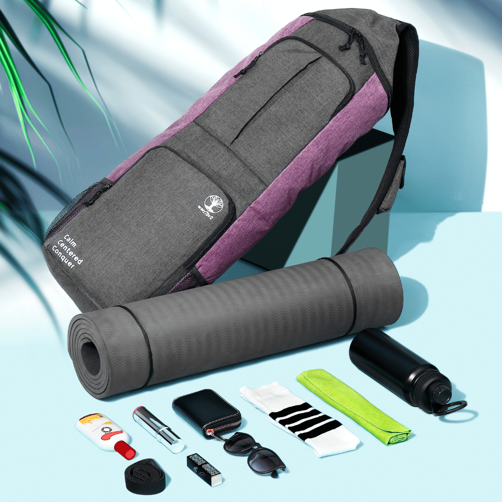 purple Warrior2 ladies yoga bag displayed upright beside a yoga mat, water bottle, sunglasses, towel, and gym essentials