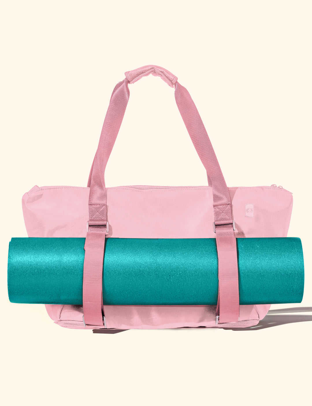 warrior2 pink yoga duffel tote bag with a teal yoga mat on a white background