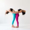 supported backbend two girls doing yoga