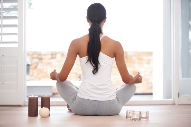 woman at home meditating yin yoga balances your chi