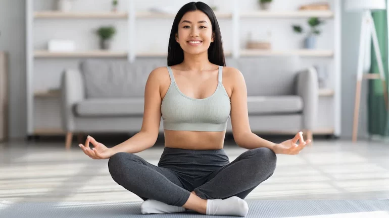 woman meditate smiling yin yoga promotes self love