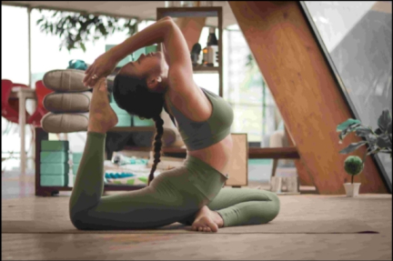 woman doing yin yoga pose in leave green active wear