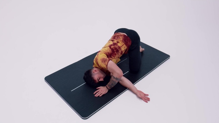 guy on yoga mat do yoga needle pose