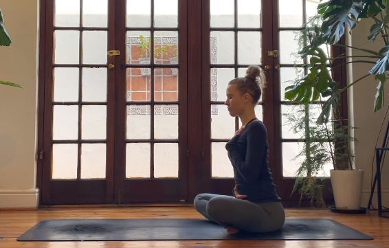 woman do cross leg seat pose yoga morning practice guide