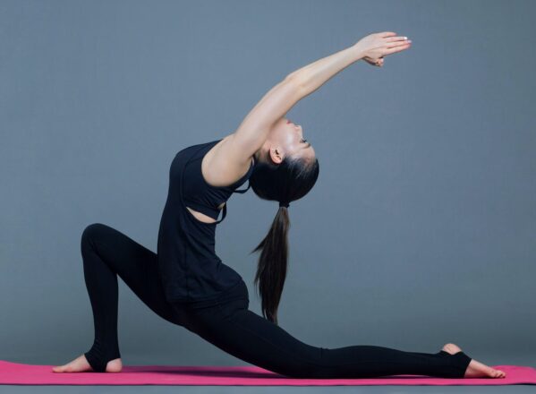 woman in black yoga pose yin yoga