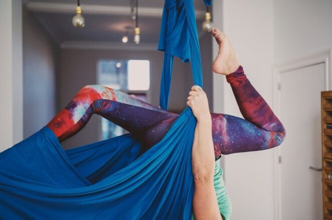 person doing aerial yoga dizziness side effects