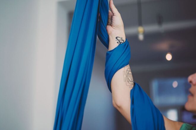 person wrap hand yoga swing aerial yoga tips