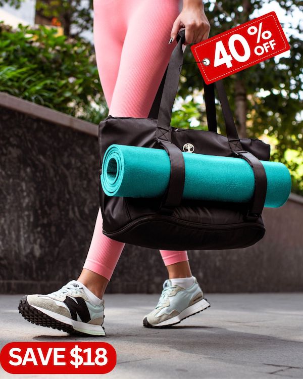 girl in pink pants walking on the pavement carrying warrior2 yoga gym bag 40% label